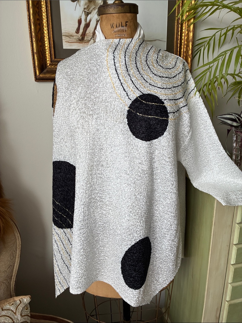berek White top with Black and Gold Graphic Accents